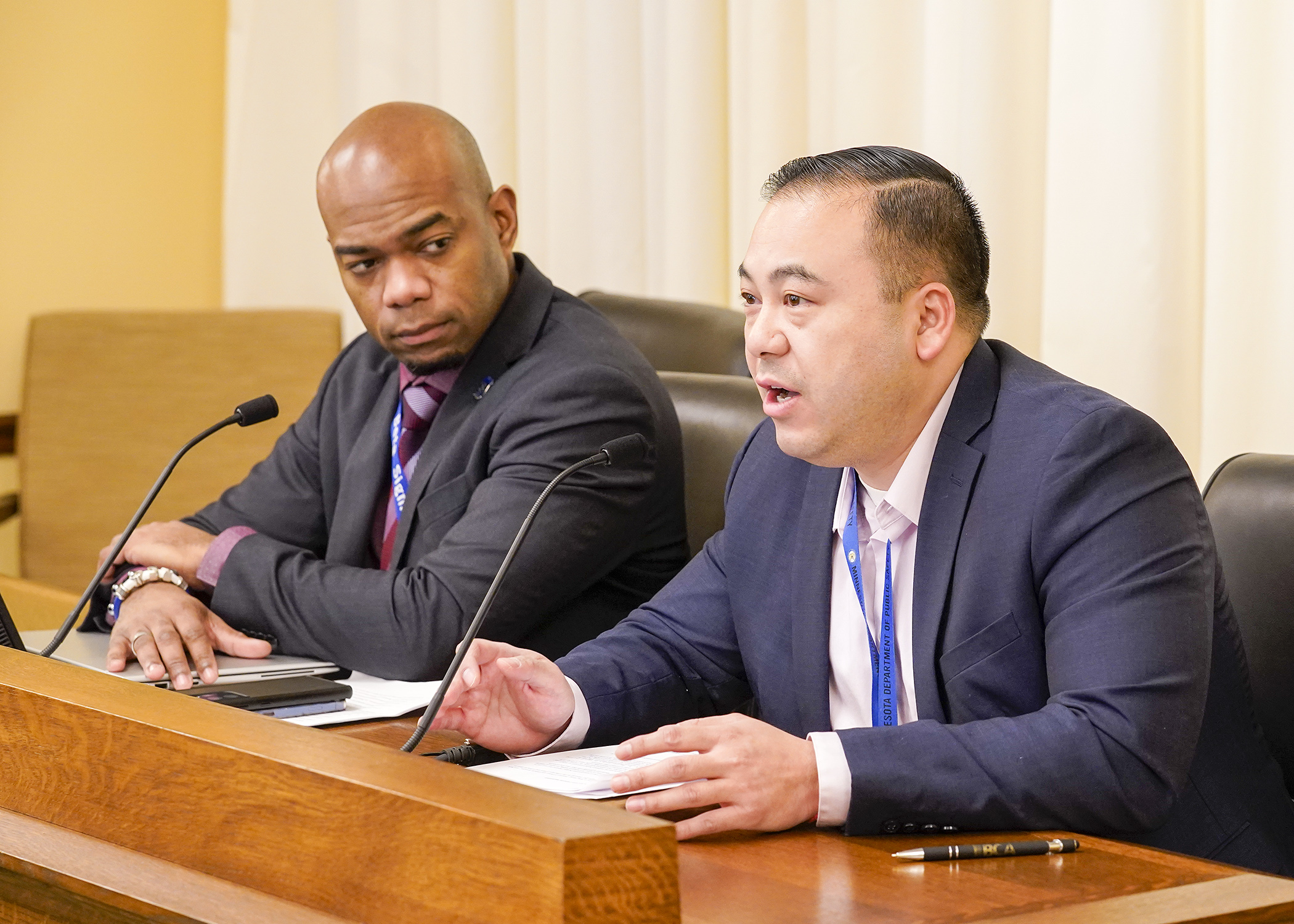 Driver and Vehicle Services Director Pong Xiong testifies before the House Transportation Finance and Policy Committee Jan. 31 in support of HF282, sponsored by Rep. Cedrick Frazier, left. (Photo by Andrew VonBank)
